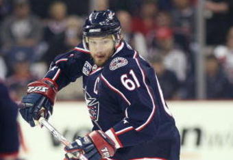 COLUMBUS, OHIO - APRIL 23:  Rick Nash #61 of the Columbus Blue Jackets chases after a loose puck with Johan Franzen #93 of the Detroit Red Wings during Game Four of the Western Conference Quarterfinals of the 2009 Stanley Cup Playoffs on April 23, 2009 at the Nationwide Arena in Columbus, Ohio. The Red Wings defeated the Blue Jackets 6-5 on a late goal by Johan Franzen to eliminate the Blue Jackets 4 games to 0. (Photo by Claus Andersen/Getty Images