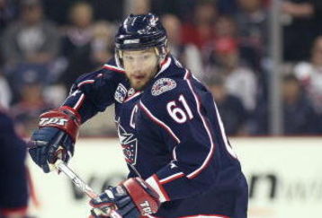 COLUMBUS, OHIO - APRIL 23:  Rick Nash #61 of the Columbus Blue Jackets chases after a loose puck with Johan Franzen #93 of the Detroit Red Wings during Game Four of the Western Conference Quarterfinals of the 2009 Stanley Cup Playoffs on April 23, 2009 at the Nationwide Arena in Columbus, Ohio. The Red Wings defeated the Blue Jackets 6-5 on a late goal by Johan Franzen to eliminate the Blue Jackets 4 games to 0. (Photo by Claus Andersen/Getty Images