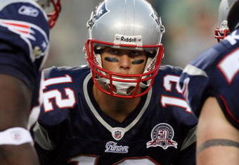 PHILADELPHIA - AUGUST 13:  Tom Brady #12 of the New England Patriots huddles with his teammates against the Philadelphia Eagles on August 13, 2009 at Lincoln Financial Field in Philadelphia, Pennsylvania.  (Photo by Jim McIsaac/Getty Images)