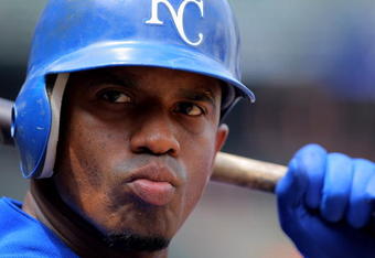 BALTIMORE - JULY 30:  Alberto Callaspo #13 of the Kansas City Royals warms up on deck against the Baltimore Orioles during MLB action at Oriole Park at Camden Yards on July 30, 2009 in Baltimore, Maryland. The Orioles defeated the Royals 7-3.  (Photo by Doug Pensinger/Getty Images)