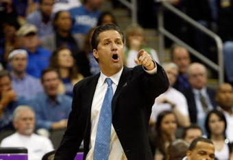 KANSAS CITY, MO - MARCH 21:  Head Coach John Calipari of the Memphis Tigers points a finger from the sideline during their second round game against the Maryland Terrapins in the NCAA Division I Men's Basketball Tournament at the Sprint Center on March 21, 2009 in Kansas City, Missouri. The Tigers defeated the Terrapins 89-70.  (Photo by Jamie Squire/Getty Images)