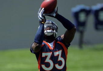 ENGLEWOOD, CO - JUNE 12:  Cornerback Alphonso Smith #33 of the Denver Broncos catches the ball as he participates in minicamp practice at the Broncos Dove Valley training facility on June 12, 2009 in Englewood, Colorado.  (Photo by Doug Pensinger/Getty Images)