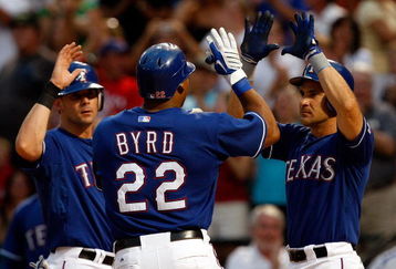 ARLINGTON, TX - JULY 31:  Marlon Byrd #22 of the Texas Rangers celebrates a three-run home run with Michael Young #10 and Omar Vizquel #13 against the Seattle Mariners on July 31, 2009 at Rangers Ballpark in Arlington, Texas.  (Photo by Ronald Martinez/Getty Images)