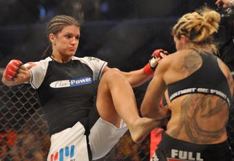 SAN JOSE, CA - AUGUST 15:  Cris Cyborg (R) battles Gina Carano during their Middleweight Championship fight at Stikeforce: Carano vs. Cyborg on August 15, 2009 in San Jose, California.  (Photo by Jon Kopaloff/Getty Images)