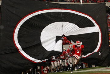 ATHENS, GA - NOVEMBER 29:  Bryan Evans #3 of the Georgia Bulldogs leads the team onto the field during pre-game festivities before the game against the Georgia Tech Yellow Jackets at Sanford Stadium on November 29, 2008 in Athens, Georgia.  The Yellow Jackets defeated the Bulldogs 45-42.  (Photo by Mike Zarrilli/Getty Images)