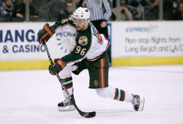LOS ANGELES - DECEMBER 15:  Pierre-Marc Bouchard #96 of the Minnesota Wild shoots the puck against the Los Angeles Kings at Staples Center on December 15, 2007 in Los Angeles, California. (Photo by Jeff Gross/Getty Images)