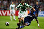 GLASGOW, SCOTLAND - AUGUST 18:  Aiden McGeady of Celtic gets tackled by Alexandra Song of Arsenal during a UEFA Champions League Qualifying match between Celtic and Arsenal at Celtic Park on August 18, 2009 in Glasgow, Scotland.  (Photo by Phil Cole/Getty Images)