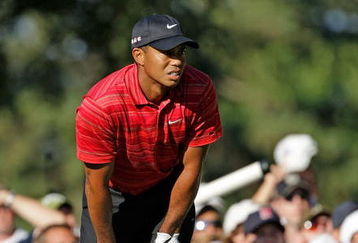 CHASKA, MN - AUGUST 16:  Tiger Woods reacts to his poor tee shot on the 17th hole during the final round of the 91st PGA Championship at Hazeltine National Golf Club on August 16, 2009 in Chaska, Minnesota.  (Photo by Jamie Squire/Getty Images)