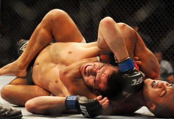 PHILADELPHIA - AUGUST 08:   Lightweight champion BJ Penn (R) battles Kenny Florian during their lightweight championship title bout at UFC 101: Declaration at the Wachovia Center on August 8, 2009 in Philadelphia, Pennsylvania.  (Photo by Jon Kopaloff/Getty Images)