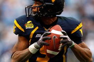 CHARLOTTE, NC - DECEMBER 27:  Jock Sanders #9 of the West Virginia Mountaineers runs with the ball against the North Carolina Tar Heels during the Meineke Car Care Bowl on December 27, 2008 at Bank of America Stadium in Charlotte, North Carolina.  (Photo by Streeter Lecka/Getty Images)