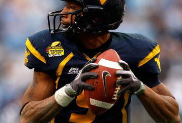 CHARLOTTE, NC - DECEMBER 27:  Jock Sanders #9 of the West Virginia Mountaineers runs with the ball against the North Carolina Tar Heels during the Meineke Car Care Bowl on December 27, 2008 at Bank of America Stadium in Charlotte, North Carolina.  (Photo by Streeter Lecka/Getty Images)