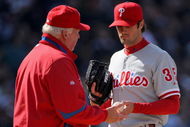 DENVER - APRIL 10:  Starting pitcher Cole Hamels #35 of the Philadelphia Phillies is removed from the game by manager Charlie Manuel #41 after 3 and 2/3 innings against the Colorado Rockies during MLB action on Opening Day at Coors Field on April 10, 2009 in Denver, Colorado. Hamels collected the loss as the Rockies defeated the Phillies 10-3.  (Photo by Doug Pensinger/Getty Images)