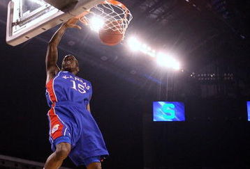 INDIANAPOLIS - MARCH 27:  Tyshawn Taylor #15 of the Kansas Jayhawks dunks against the Michigan State Spartans during the third round of the NCAA Division I Men's Basketball Tournament at the Lucas Oil Stadium on March 27, 2009 in Indianapolis, Indiana.  (Photo by Andy Lyons/Getty Images)