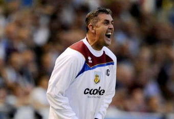 BURNLEY, ENGLAND - AUGUST 19:   Burnley Manager Owen Coyle screams instructions from the sidelines during the Barclays Premier League match between Burnley and Manchester United at Turf Moor on August 19, 2009 in Burnley, England.  (Photoby Laurence Griffiths/Getty Images)