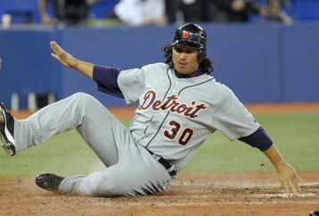 TORONTO - APRIL 6: Magglio Ordonez #30 of the Detroit Tigers slides across home plate during the Opening Day game against the Toronto Blue Jays at the Rogers Centre April 6, 2009 in Toronto, Ontario. (Photo by: Dave Sandford/Getty Images)