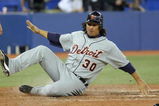 TORONTO - APRIL 6: Magglio Ordonez #30 of the Detroit Tigers slides across home plate during the Opening Day game against the Toronto Blue Jays at the Rogers Centre April 6, 2009 in Toronto, Ontario. (Photo by: Dave Sandford/Getty Images)