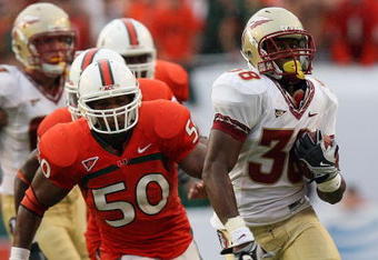 MIAMI - OCTOBER 04:  Running back Jermaine Thomas #38 of the Florida State Seminoles breaks away from linebacker Darryl Sharpton #50 of the Miami Hurricanes at Dolphin Stadium on October 4, 2008 in Miami, Florida. Florida State defeated Miami 41-39.  (Photo by Doug Benc/Getty Images)