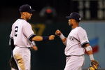 OAKLAND, CA - AUGUST 18:  Derek Jeter #2 and Robinson Cano #24 of the New York Yankees celebrate after they beat the Oakland Athletics at the Oakland Colisuem on August 18, 2009 in Oakland, California.  (Photo by Ezra Shaw/Getty Images)