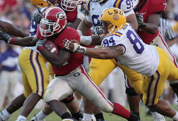 BATON ROUGE, LA - OCTOBER 25:  Knowshon Moreno #24 of Georgia outruns the tackle of Rahim Alem #84 in the second half of their football game at Tiger Stadium on October 25, 2008 in Baton Rouge, Louisiana.  Georgia won 52-38. (Photo by Dave Martin/Getty Images)