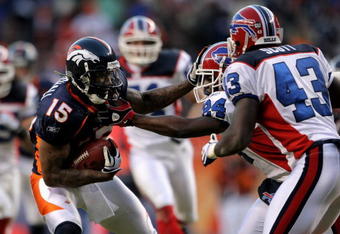 DENVER - DECEMBER 21:  Wide receiver Brandon Marshall #15 of the Denver Broncos makes a reception as Terrence McGee #24 of the Buffalo Bills defends during NFL action at Invesco Field at Mile High on December 21, 2008 in Denver, Colorado. The Bills defeated the Broncos 30-23.  (Photo by Doug Pensinger/Getty Images)