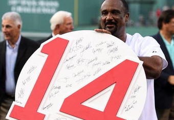 BOSTON - JULY 28:  Former Boston Red Sox outfielder Jim Rice shows off his retired number plaque during a ceremony before the Boston Red Sox game against the Oakland Athletics at Fenway Park July 28, 2009 in Boston, Massachusetts.  (Photo by Elsa/Getty Images)
