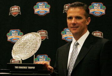 FORT LAUDERDALE, FL - JANUARY 07:  Head coach Urban Meyer of the Florida Gators poses with the 'The Coaches' Trophy' during the FedEx BCS Head Coaches Press Conference at Harbor Beach Marriott Resort & Spa on January 7, 2009 in Fort Lauderdale, Florida.  (Photo by Doug Benc/Getty Images)