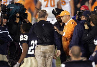 SOUTH BEND, ID - NOVEMBER 05:  Head coach Phillip Fulmer of the University of Tennessee Volunteers congratulates head coach Charlie Weis of the Notre Dame Fighting Irish following a game on November 5, 2005 at Notre Dame Stadium in South Bend, Indiana. Notre Dame defeated Tennessee 41-21.  (Photo by Jonathan Daniel/Getty Images)