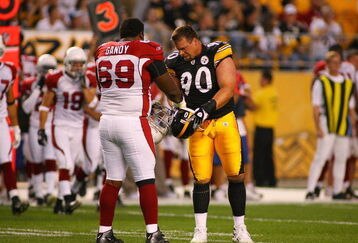 PITTSBURGH - AUGUST 13:  Mike Gandy #69 of the Arizona Cardinals and Travis Kirschke #90 of the Pittsburgh Steelers meet on the field during the preseason NFL game at Heinz Field on August 13, 2009 in Pittsburgh, Pennsylvania.  The Steelers won 20-10.  (Photo by Rick Stewart/Getty Images)