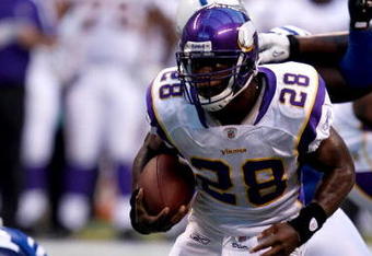 INDIANAPOLIS, IN - AUGUST 14: Running back Adrian Peterson #28 of the Minnesota Vikings runs with the football against the Indianapolis Colts at Lucas Oil Stadium on August 14, 2009 in Indianapolis, Indiana. (Photo by Scott Boehm/Getty Images)