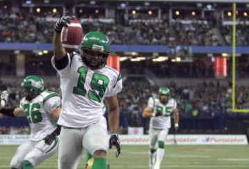 TORONTO - NOVEMBER 25:  James Johnson #19 of the Saskatchewan Rough Riders jumps over a fallen Ryan Dinwiddie #4 after his interception to score a touchdown to tie the game 7-7 against the Winnipeg Blue Bombers during the second quarter of the 95th Grey Cup on November 25, 2007 at the Rogers Centre in Toronto, Ontario, Canada.  Johnson would be the MVP in a 23-19 Rough Rider win.  (Photo by Harry How/Getty Images)