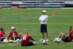 FOXBOROUGH, MA - JUNE 9: Quarterbacks (L-R) Tom Brady #12, Doug Flutie #2, Rohan Davey #6, and Matt Cassel #16 gather around quarterback coach Josh McDaniels during a break at New England Partriots mini-camp on the practice field at Gillette Stadium on June 9, 2005 in Foxborough, Massachusetts. (Photo by Jim McIsaac/Getty Images)    