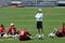 FOXBOROUGH, MA - JUNE 9: Quarterbacks (L-R) Tom Brady #12, Doug Flutie #2, Rohan Davey #6, and Matt Cassel #16 gather around quarterback coach Josh McDaniels during a break at New England Partriots mini-camp on the practice field at Gillette Stadium on June 9, 2005 in Foxborough, Massachusetts. (Photo by Jim McIsaac/Getty Images)    