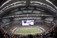 ARLINGTON, TX - AUGUST 21:  Quarterback Tony Romo #9 of the Dallas Cowboys leads his team in the second quarter against the Tennessee Titans during a preseason game at Cowboys Stadium on August 21, 2009 in Arlington, Texas. (Photo by Tom Pennington/Getty Images)