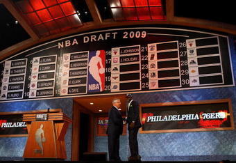 NEW YORK - JUNE 25:  NBA Commissioner David Stern poses for a photograph with the seventeenth overall draft pick by the Philadelphia 76ers,  Jrue Holiday during the 2009 NBA Draft at the Wamu Theatre at Madison Square Garden June 25, 2009 in New York City. NOTE TO USER: User expressly acknowledges and agrees that, by downloading and/or using this Photograph, User is consenting to the terms and conditions of the Getty Images License Agreement.  (Photo by Jim McIsaac/Getty Images)