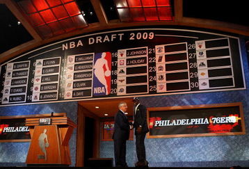 NEW YORK - JUNE 25:  NBA Commissioner David Stern poses for a photograph with the seventeenth overall draft pick by the Philadelphia 76ers,  Jrue Holiday during the 2009 NBA Draft at the Wamu Theatre at Madison Square Garden June 25, 2009 in New York City. NOTE TO USER: User expressly acknowledges and agrees that, by downloading and/or using this Photograph, User is consenting to the terms and conditions of the Getty Images License Agreement.  (Photo by Jim McIsaac/Getty Images)