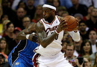 CLEVELAND - MAY 28:  LeBron James #23 of the Cleveland Cavaliers handles the ball against Mickael Pietrus #20 of the Orlando Magic in Game Five of the Eastern Conference Finals during the 2009 Playoffs at Quicken Loans Arena on May 28, 2009 in Cleveland, Ohio. NOTE TO USER: User expressly acknowledges and agrees that, by downloading and or using this photograph, User is consenting to the terms and conditions of the Getty Images License Agreement  (Photo by Gregory Shamus/Getty Images)