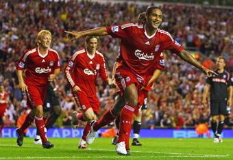 LIVERPOOL, ENGLAND - AUGUST 19:  Glen Johnson of Liverpool celebrates scoring his team's second goal during the Barclays Premier League match between Liverpool and Stoke City at Anfield on August 19, 2009 in Liverpool, England.  (Photo by Clive Brunskill/Getty Images)