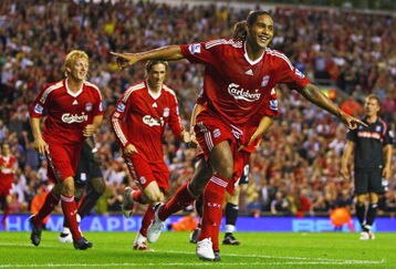 LIVERPOOL, ENGLAND - AUGUST 19:  Glen Johnson of Liverpool celebrates scoring his team's second goal during the Barclays Premier League match between Liverpool and Stoke City at Anfield on August 19, 2009 in Liverpool, England.  (Photo by Clive Brunskill/Getty Images)