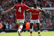 LONDON - APRIL 26:  Cesc Fabregas of Arsenal celebrates with his team mate Emmanuel Eboue after Fabregas scored the second goal during the Barclays Premier League match between Arsenal and Middlesbrough at Emirates Stadium on April 26, 2009 in London, England.  (Photo by Hamish Blair/Getty Images)