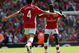 LONDON - APRIL 26:  Cesc Fabregas of Arsenal celebrates with his team mate Emmanuel Eboue after Fabregas scored the second goal during the Barclays Premier League match between Arsenal and Middlesbrough at Emirates Stadium on April 26, 2009 in London, England.  (Photo by Hamish Blair/Getty Images)