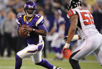MINNEAPOLIS - DECEMBER 21:  Tarvaris Jackson #7  of the Minnesota Vikings scrambles under pressure from John Abraham #55 of the Atlanta Falcons during an NFL game at the Hubert H. Humphrey Metrodome, on December 21, 2008 in Minneapolis, Minnesota.  (Photo by Tom Dahlin/Getty Images)