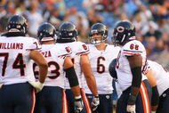 ORCHARD PARK, NY - AUGUST 15:  Jay Cutler #6 of the Chicago Bears huddles with teammates against the Buffalo Bills on  August 15, 2009 at Ralph Wilson Stadium in Orchard Park, New York.  (Photo by Rick Stewart/Getty Images)