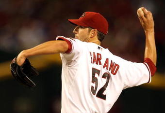 PHOENIX - APRIL 10:  Starting pitcher Jon Garland #52 of the Arizona Diamondbacks pitches against the Los Angeles Dodgers during the game at Chase Field on April 10, 2009 in Phoenix, Arizona. The Diamondbacks defeated the Dodgers 9-4.  (Photo by Christian Petersen/Getty Images)