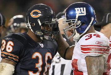 CHICAGO - DECEMBER 2:  Brandon McGowan #36 of the New York Giants and Derrick Ward #34 of the Chicago Bears talk during the NFL game at Soldier Field on December 2, 2007 in Chicago, Illinois. (Photo by Jonathan Daniel/Getty Images)