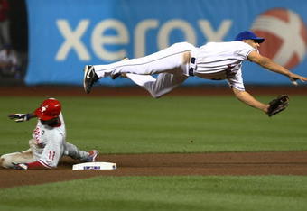 NEW YORK - JUNE 09: Jimmy Rollins #11 of the Philadelphia Phillies is out at second as Alex Cora #3 of the New York Mets throws to first base  during their game at Citi Field on June 9, 2009 in the Flushing neighborhood of the Queens borough of New York City.  (Photo by Chris McGrath/Getty Images)