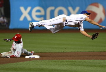 NEW YORK - JUNE 09: Jimmy Rollins #11 of the Philadelphia Phillies is out at second as Alex Cora #3 of the New York Mets throws to first base  during their game at Citi Field on June 9, 2009 in the Flushing neighborhood of the Queens borough of New York City.  (Photo by Chris McGrath/Getty Images)