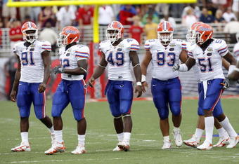 OXFORD, MS - SEPTEMBER 22: Derrick Harvey #91, Dustin Doe #32, Jermaine Cunningham #49, Javier Estopinan #93 and Brandon Spikes #51 of the Florida Gators get set on defense against the Mississippi Rebels on September 22, 2007 at Vaught-Hemingway Stadium/Hollingsworth Field in Oxford, Mississippi. Florida won  30-24. (Photo by Joe Murphy/Getty Images)