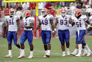 OXFORD, MS - SEPTEMBER 22: Derrick Harvey #91, Dustin Doe #32, Jermaine Cunningham #49, Javier Estopinan #93 and Brandon Spikes #51 of the Florida Gators get set on defense against the Mississippi Rebels on September 22, 2007 at Vaught-Hemingway Stadium/Hollingsworth Field in Oxford, Mississippi. Florida won  30-24. (Photo by Joe Murphy/Getty Images)