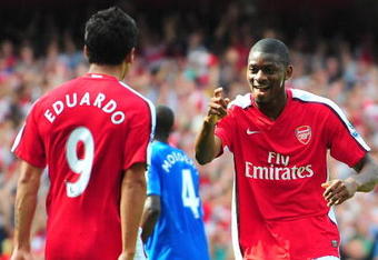 LONDON, ENGLAND - AUGUST 22:  Abou Diaby of Arsenal celebrates his goal with teammate Eduardo during the Barclays Premier League match between Arsenal and Portsmouth at the Emirates Stadium on August 22, 2009 in London, England.  (Photo by Mike Hewitt/Getty Images)
