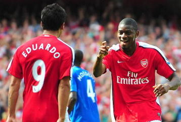 LONDON, ENGLAND - AUGUST 22:  Abou Diaby of Arsenal celebrates his goal with teammate Eduardo during the Barclays Premier League match between Arsenal and Portsmouth at the Emirates Stadium on August 22, 2009 in London, England.  (Photo by Mike Hewitt/Getty Images)